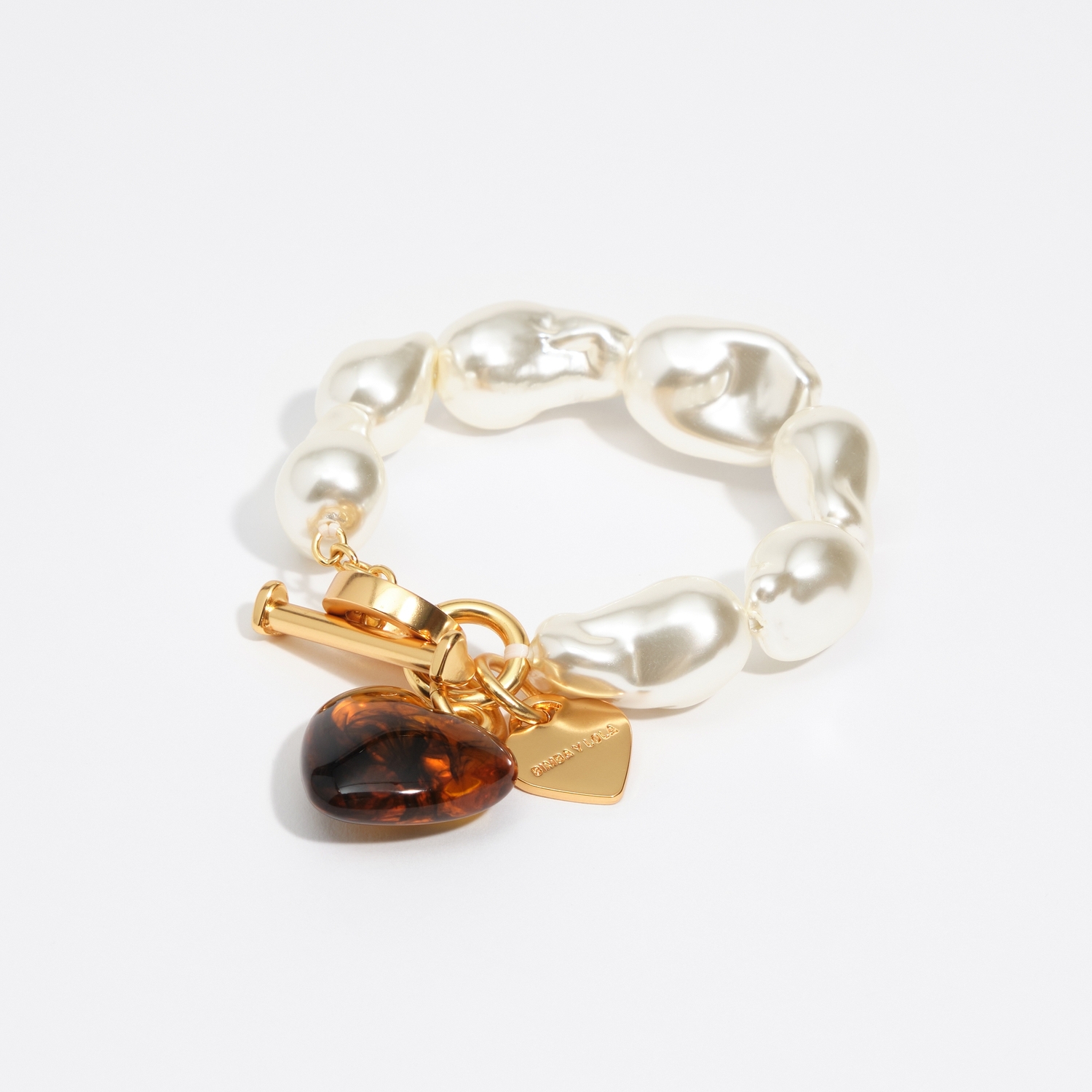 BIMBA Y LOLA Elastic bracelet with pearls and amber resin heart